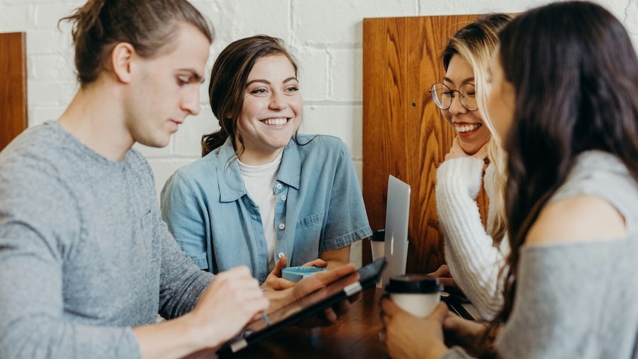 A group of people chatting and laughing.