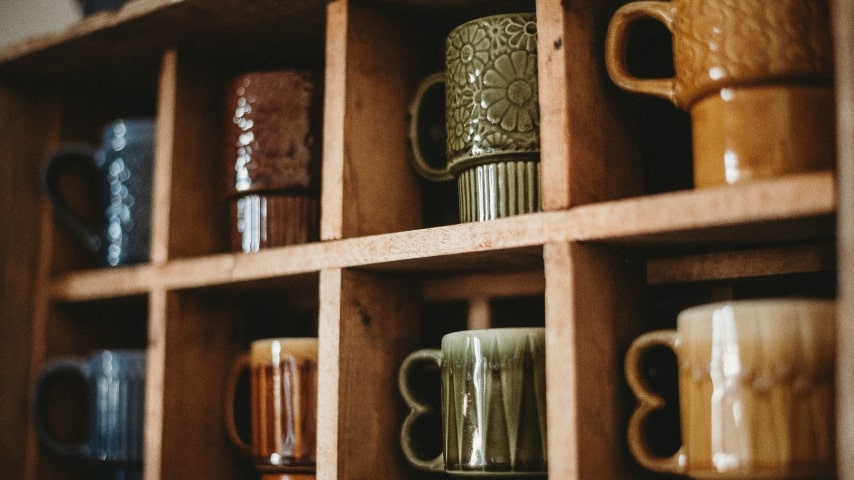 Mugs placed in shelves. 