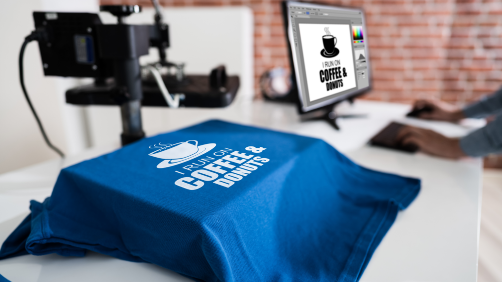 A coffee logo shirt is placed on a desk, highlighting a blend of comfort and passion for coffee culture.